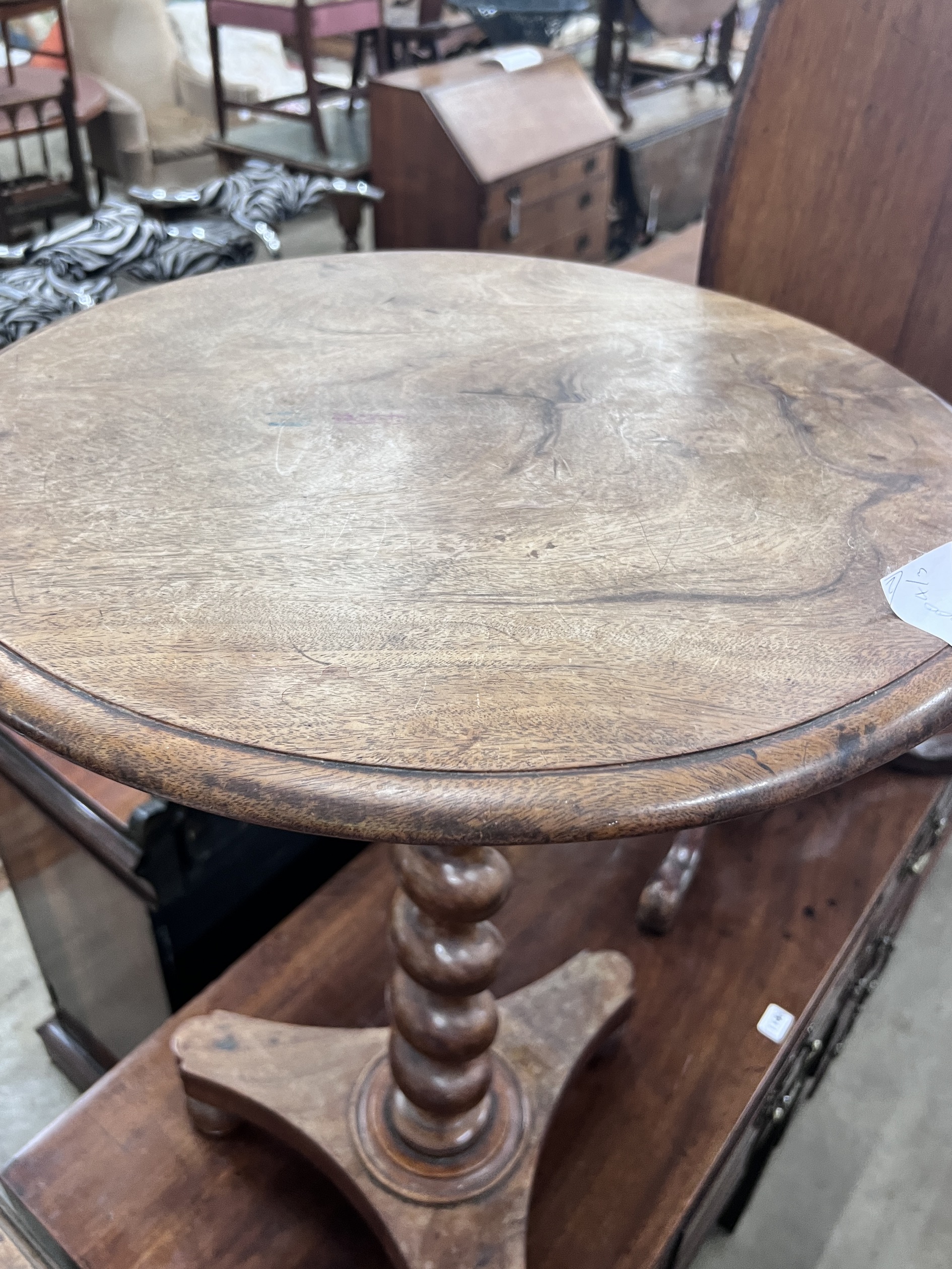 A Victorian spiral stem circular mahogany wine table, diameter 50cm, height 71cm, together with a Victorian oval mahogany tilt top tripod table